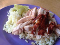 Large pieces of chicken on rice